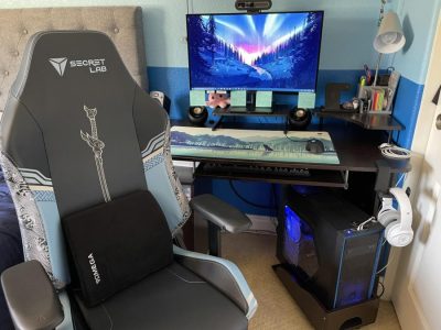 A gaming set up with monitor, computer, and SecretLab gaming chair