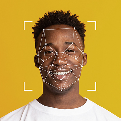 Closeup of young man's face with vector mapping overlaid in white.